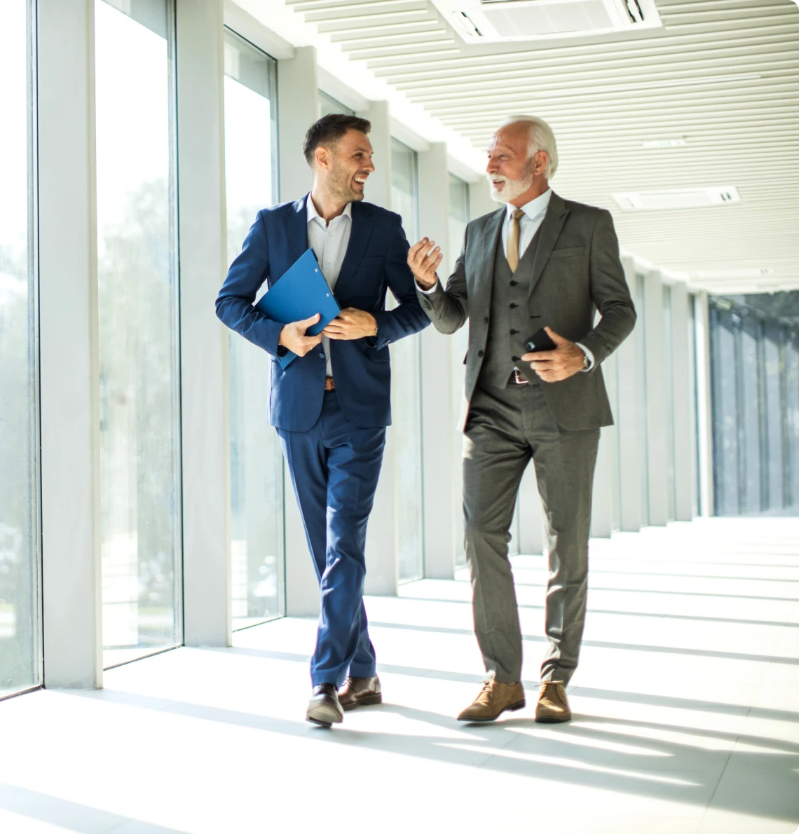 Colleagues discussing business ideas while walking