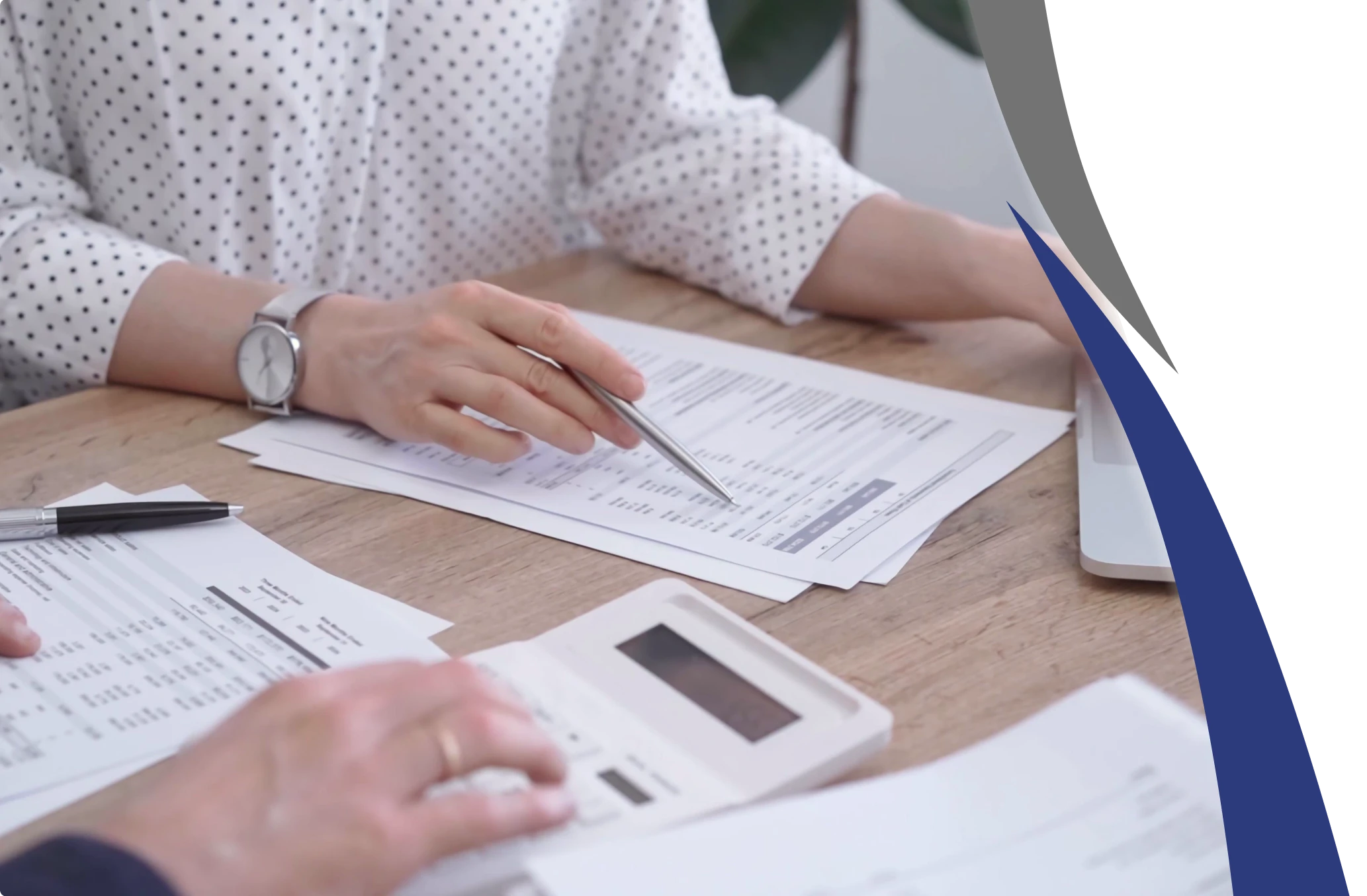 Two persons analyzing financial reports